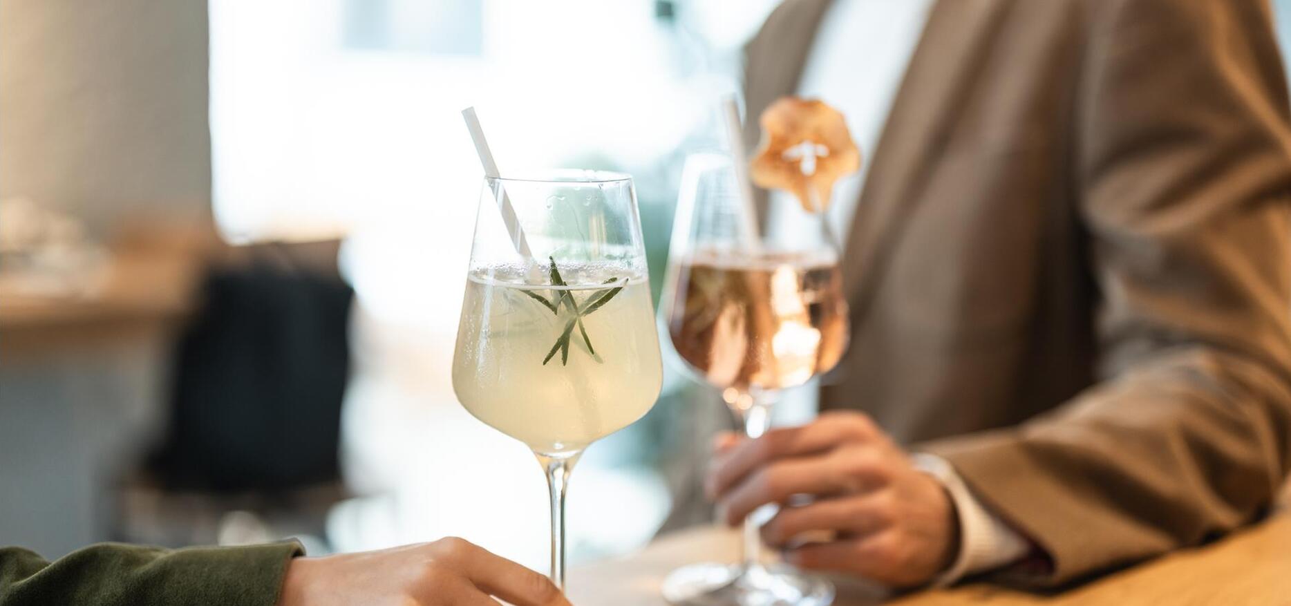 Two people are drinking an aperitif