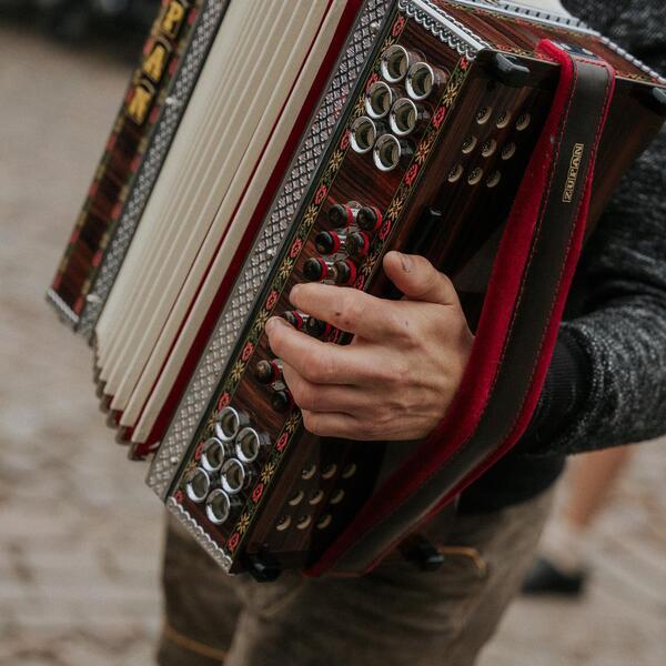 A person is playing the accordion